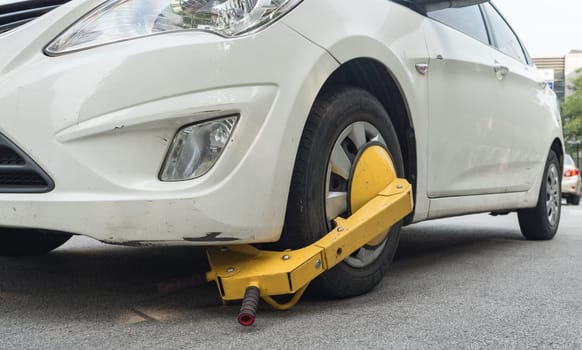 Locked wheel of a car parked in an improper place