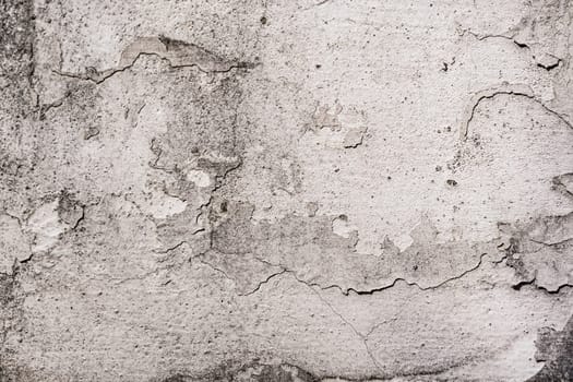 Old cracked plaster wall surface for background or texture