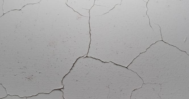 Old cracked plaster wall surface for background or texture