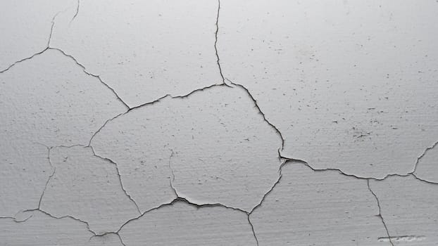 Old cracked plaster wall surface for background or texture