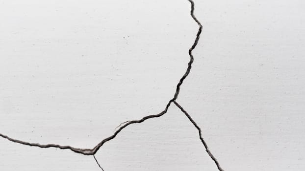 Old cracked plaster wall surface for background or texture