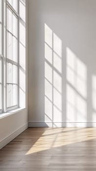 A empty room with a window and hardwood floor