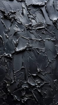 A close up of a black painted wall with some scratches