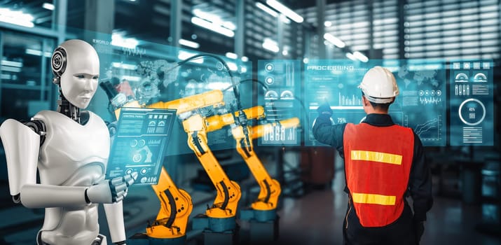 MLB Mechanized industry robot and human worker working together in future factory. Concept of artificial intelligence for industrial revolution and automation manufacturing process.