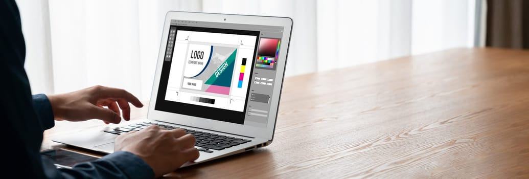 Graphic designer software for modern design of web page and commercial ads showing on the computer screen
