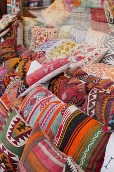 Colourful cushions on display for sale in a traditional Turkish Bazaar