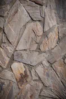 grey stone dark wall of medieval horizontal stones facade background 2