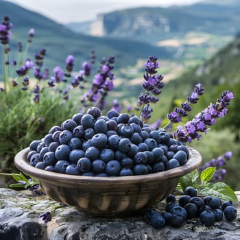A dish of blueberries sits on a table with purple flowers in the background, showcasing the natural beauty of these seedless fruits. Perfect for a healthy snack or ingredient in various dishes