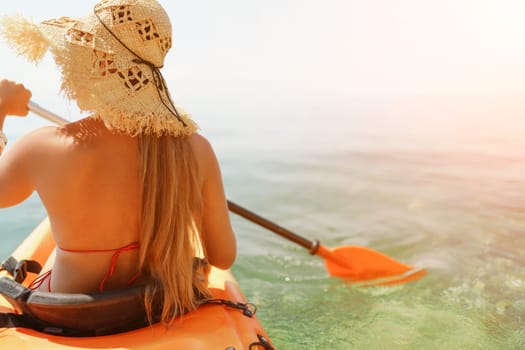 woman straw hat paddling a kayak on a lake. The sun is shining brightly, creating a warm and inviting atmosphere