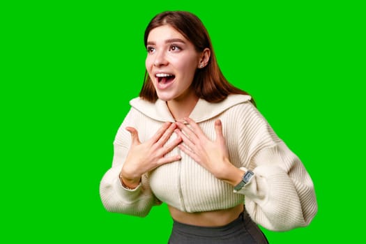 A woman wearing a skirt and sweater is striking a pose for a picture, standing confidently in front of the camera. Her outfit consists of a colorful skirt and a cozy sweater, giving off a stylish and fashionable vibe.