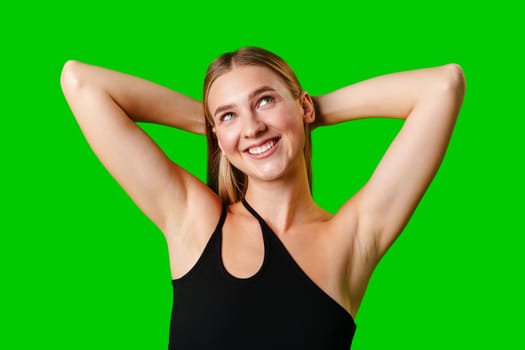 Blonde Woman in Black Tank Top Posing for Picture in studio