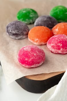 Multi-colored Japanese cakes Mochi in a white plate close up