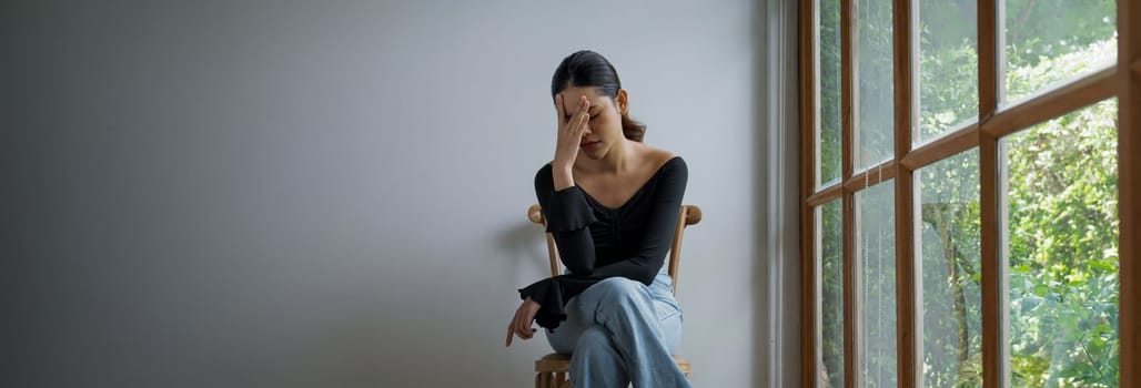 Depressed young Asian woman with mental health problem in mind need uttermost treatment from overthinking fatigue, disruptive thought, dissocial, anxiety and other mental health disorders .