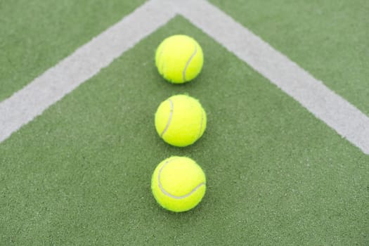 Tennis ball on green grass. High quality photo