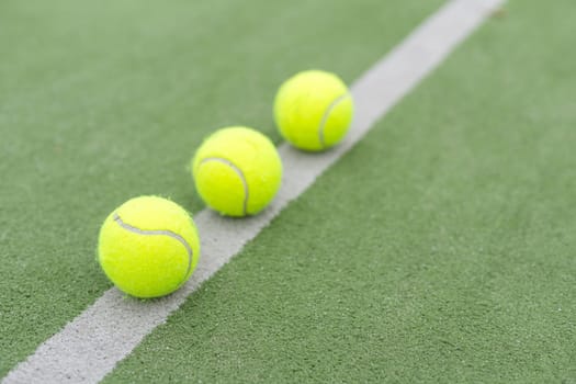 close up of a padel and tennis court with artificial grass and balls. High quality photo