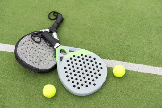 Paddle tennis objects on grass court. High quality photo