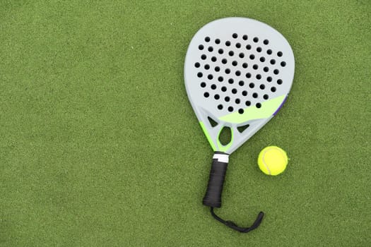 Paddle tennis racket and ball. High quality photo