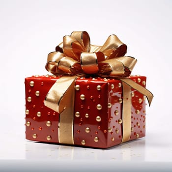 Red gift with gold dots and gold bow white background. Gifts as a day symbol of present and love. A time of falling in love and love.