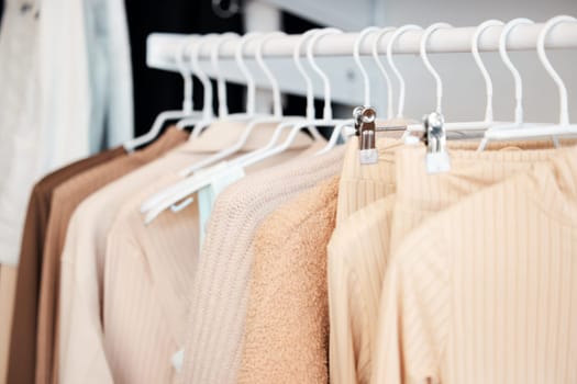 Retail, hanger and clothing in store, fashion and boutique for sale for designer garments. Rack, fabric and casual wardrobe outfit choice, rail and purchase or shop for pastel discount material.
