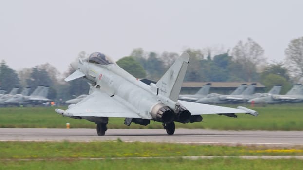 Istrana Italy April 5 2024: Eurofighter Typhoon of Italian Air Force Take Off. Close Up from Behind. Copy Space.
