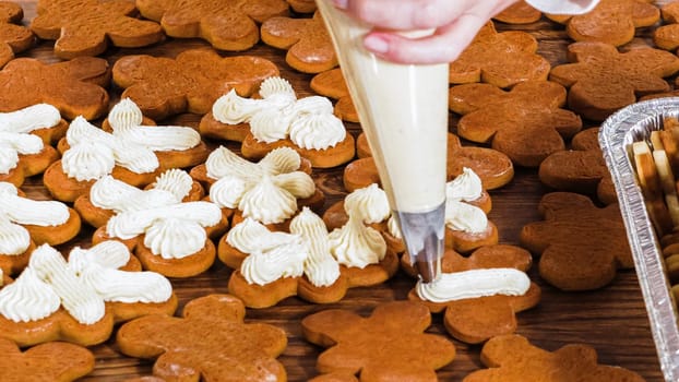 Crafting gingerbread cookie sandwiches with eggnog buttercream, presented on a rustic wooden table for Christmas gifting.