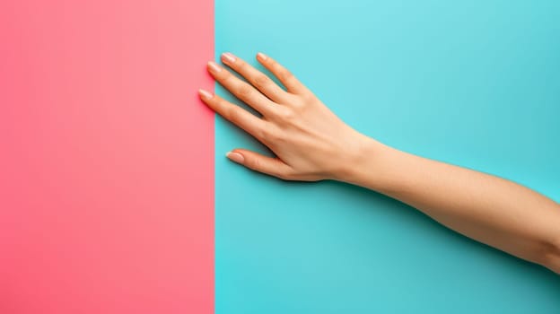 A hand reaching out to touch a pink and blue wall