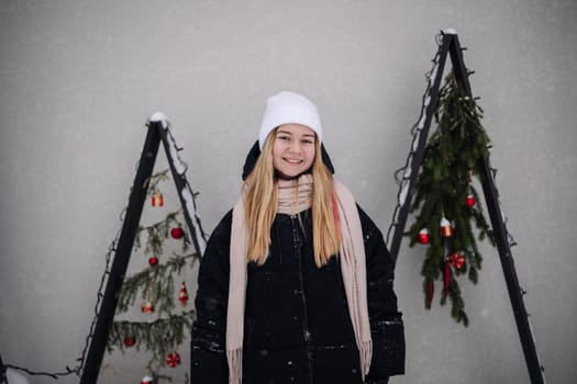 Portrait of a teenage girl outside a cafe in winter
