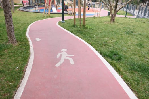 Track with rubber-band covering for walking ,