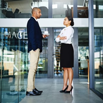 Business people, coffee and talk in lobby on project, teamwork and accountants for discussion. Employees, finance and drinking tea or speaking for support, collaboration and working together on idea.