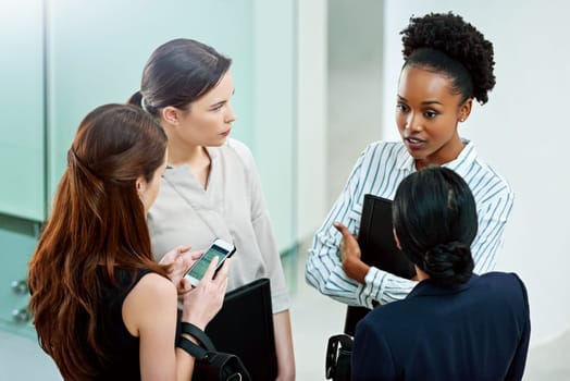 Business people, planning and talking on project in office, teamwork and women for conversation. Employees, lobby and speaking on company growth, communication and high angle or collaboration on idea.