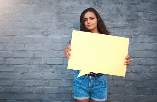 Brick, wall and girl with speech bubble, smile and opinion for promotion, marketing and announcement. Portrait, outdoor and person with mockup, advertising and discount or deal in store and USA.