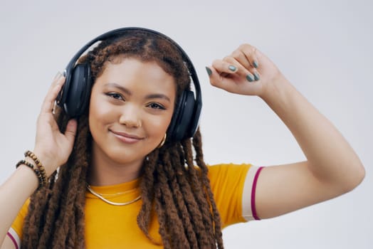 Woman, backdrop or dance with headphones or hand in closeup, streaming or music with happiness. Female student and celebrate in studio with audio for podcast, happy with sound in California or USA.