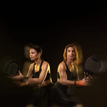 Padel tennis doubles. Two athletes players with racket. Women with paddle racket on court. Sport concept. Download a high quality photo for the design of a sports app.