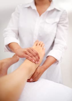 Foot, hands and massage with spa for self care, beauty and skincare at luxury resort for peace and wellness. Pedicure, cosmetics and people for feet muscle with healing for treatment and relief.