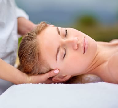 Woman, spa and relax with head massage with stress relief for comfort with closeup or health. Zen, calm and resting with masseuse hands for wellbeing on holiday at sha wellness clinic Spain for bliss.