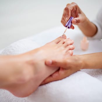 Foot, hands and nail polish for pedicure closeup with treatment, skin and dermatology with makeup at spa. Beauty, wellness and people with cosmetics product for color, self care and cosmetology.