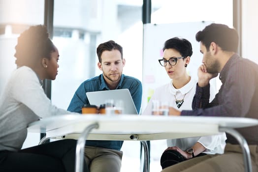 Business people, meeting and laptop with discussion in office for kpi analysis, sales research and planning. Diversity, communication and teamwork with tech for project management, review and support.