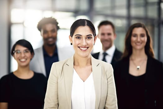 Teamwork, office and portrait of woman with business people for partnership, collaboration and about us. Professional lawyers, diversity and men and women with confidence, company pride and smile.