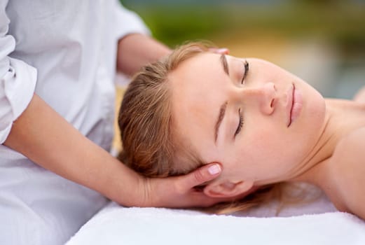 Woman, relax and spa with head massage for comfort with stress relief or physical therapy. Calm, zen and resting with improved sleep, confidence boost and detox or purity with procedure for wellbeing.