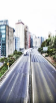 City, blur and motion with urban, abstract and street for New York cityscape and architecture. Manhattan, background and metropolitan backdrop for speed, transportation and highway road downtown.