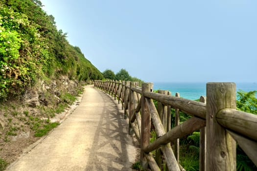 path with wooden fencing along the Atlantic Ocean, Northern Route Basque Country