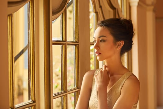 Fashion, window and woman in vintage home for gala event in style, classy outfit and formal clothes. Thinking, aesthetic and person with confidence, pride and luxury in manor, house and mansion.