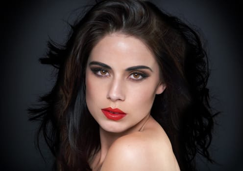 Beauty, makeup and portrait of woman on black background for skincare, wellness and glamour. Cosmetology, aesthetic and face of confident person with red lipstick, cosmetics and salon care in studio.