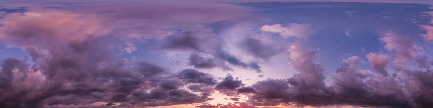 Dramatic Sunset sky 360 panorama. Vibrant sky with bright glowing red pink Cumulus clouds. HDR 360 seamless spherical panorama. Sky dome for aerial drone panoramas. Climate and weather change