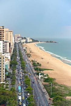Drone, beach and road with nature, sunshine and vacation with getaway trip, Rio de Janeiro and summer. Seaside, ocean and sand with buildings, travel and adventure with journey, aerial view or Brazil.