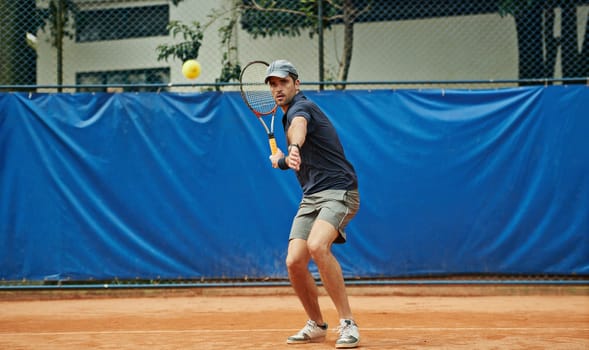 Man, tennis ball and game in outdoor court, sports and play for competition or practice. Male person, athlete and ready for training or exercise, workout and match for action and challenge fitness.