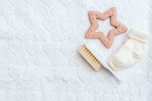 Key items for newborn care meticulously arranged in a flat lay style on a clean white background