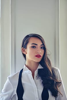 Beauty, fashion and portrait of woman in home with elegant style, classy outfit and glamour. Cosmetology, aesthetic and face of confident person with red lipstick, cosmetics and serious attitude.