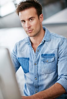 Portrait, serious and business man in office startup, company or workplace for career in Sweden. Professional, creative entrepreneur or face of confident employee, worker or editor on computer at job.