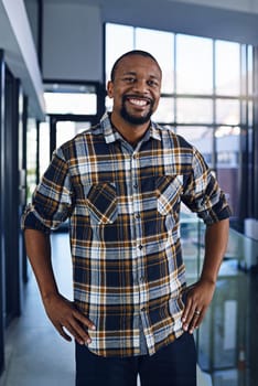 Black man, office and portrait with happy, smile and confidence from design work and job. Architect, entrepreneur and proud professional at an architecture company ready for working at a startup.